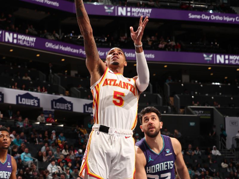 CHARLOTTE, NC - FEBRUARY 14: Dejounte Murray #5 of the Atlanta Hawks drives to the basket during the game against the Charlotte Hornets on February 14, 2024 at Spectrum Center in Charlotte, North Carolina. NOTE TO USER: User expressly acknowledges and agrees that, by downloading and or using this photograph, User is consenting to the terms and conditions of the Getty Images License Agreement. Mandatory Copyright Notice: Copyright 2024 NBAE (Photo by Kent Smith/NBAE via Getty Images)