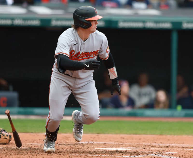 Sep 24, 2023; Cleveland, Ohio, USA; Baltimore Orioles catcher Adley Rutschman (35) hits an RBI single against the Cleveland Guardians during the fourth inning at Progressive Field. Mandatory Credit: Aaron Josefczyk-USA TODAY Sports