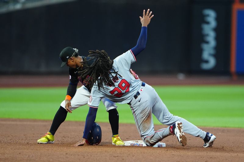 Jul 10, 2024; New York City, New York, USA; Washington Nationals left fielder James Wood (29) is tagged out by New York Mets shortstop Francisco Lindor (12) attempting to steal second base during the fifth inning at Citi Field. Mandatory Credit: Gregory Fisher-USA TODAY Sports