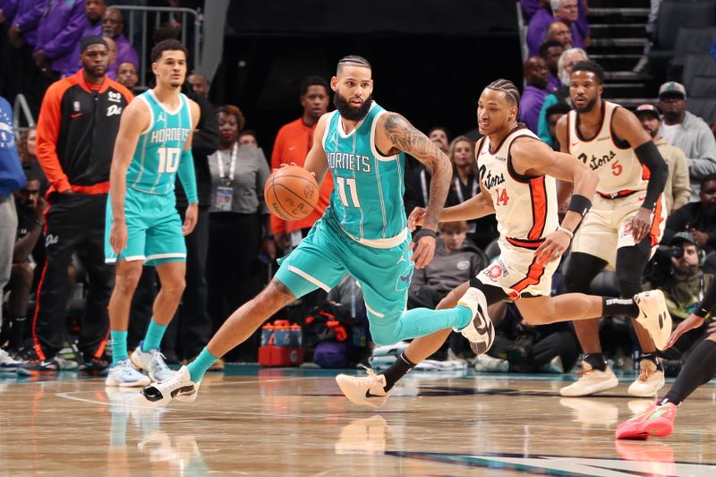 CHARLOTTE, NC - NOVEMBER 21: Cody Martin #11 of the Charlotte Hornets dribbles the ball during the game against the Detroit Pistons on November 21, 2024 at Spectrum Center in Charlotte, North Carolina. NOTE TO USER: User expressly acknowledges and agrees that, by downloading and or using this photograph, User is consenting to the terms and conditions of the Getty Images License Agreement. Mandatory Copyright Notice: Copyright 2024 NBAE (Photo by Kent Smith/NBAE via Getty Images)