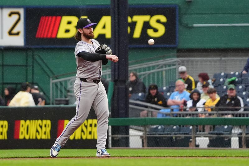 May 4, 2024; Pittsburgh, Pennsylvania, USA; Colorado Rockies second baseman Brendan Rodgers (7) throws out Pittsburgh Pirates catcher Yasmani Grandal (not pictured) after fielding a ground ball during the seventh inning at PNC Park. Mandatory Credit: Gregory Fisher-USA TODAY Sports