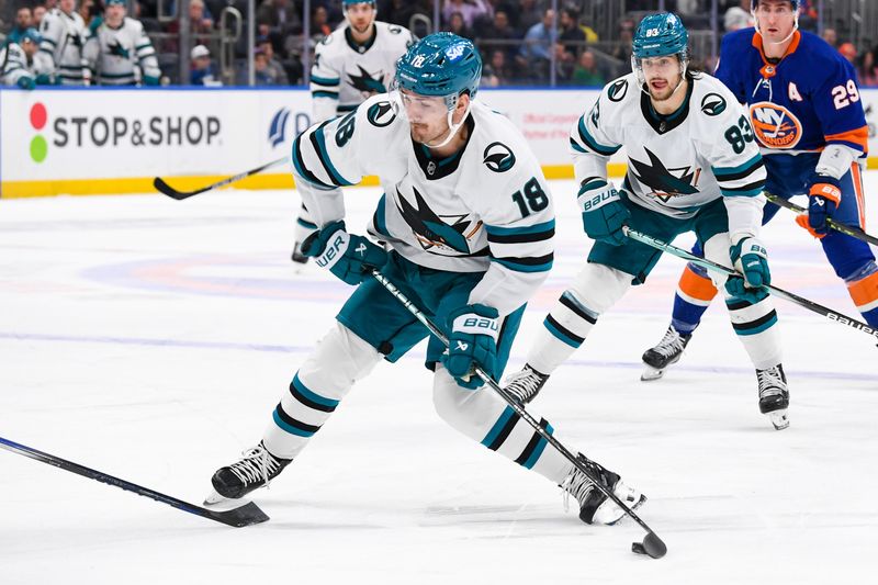 Dec 5, 2023; Elmont, New York, USA; San Jose Sharks right wing Filip Zadina (18) attempts a shot against the New York Islanders during the first period at UBS Arena. Mandatory Credit: Dennis Schneidler-USA TODAY Sports