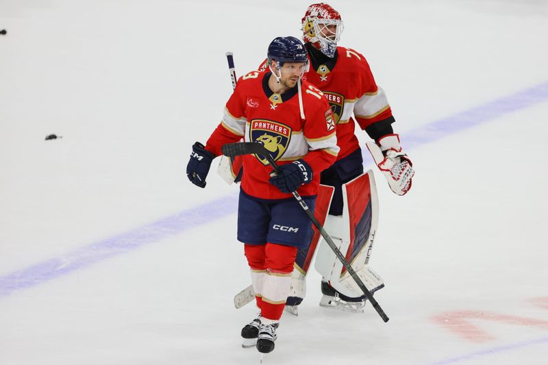 Apr 13, 2024; Sunrise, Florida, USA; Florida Panthers center Sam Reinhart (13) celebrates with Florida Panthers goaltender Sergei Bobrovsky (72) after the game against the Buffalo Sabres at Amerant Bank Arena. Mandatory Credit: Sam Navarro-USA TODAY Sports