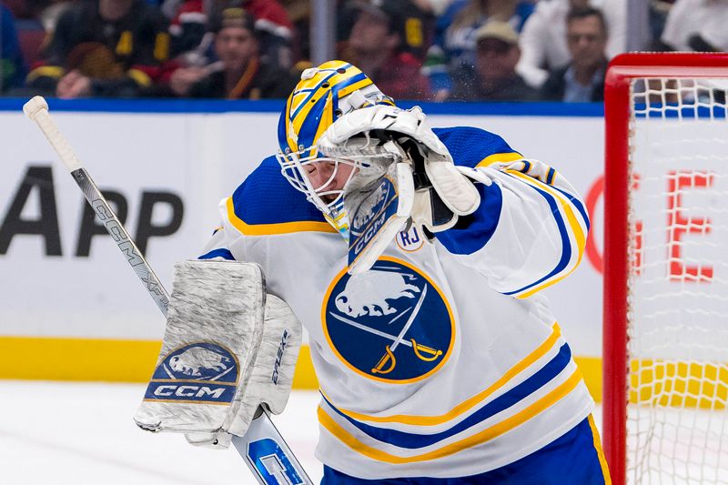 Mar 19, 2024; Vancouver, British Columbia, CAN; Buffalo Sabres goalie Devon Levi (27) makes a save against the Vancouver Canucks in the first period at Rogers Arena. Mandatory Credit: Bob Frid-USA TODAY Sports