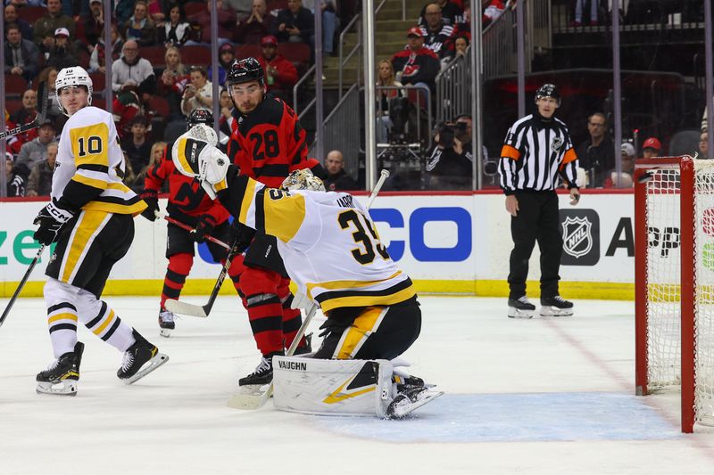 Mar 19, 2024; Newark, New Jersey, USA; New Jersey Devils right wing Timo Meier (28) scores a goal on Pittsburgh Penguins goaltender Tristan Jarry (35) during the second period at Prudential Center. Mandatory Credit: Ed Mulholland-USA TODAY Sports