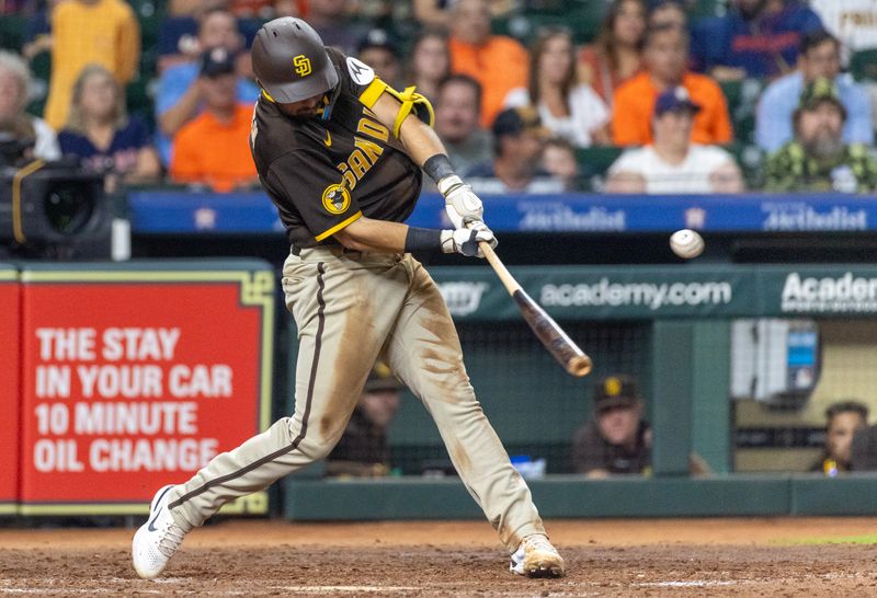 Sep 9, 2023; Houston, Texas, USA; San Diego Padres third baseman Matthew Batten (17) hits a RBI single against the Houston Astros in the sixth inning at Minute Maid Park. Mandatory Credit: Thomas Shea-USA TODAY Sports