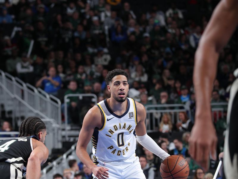 MILWAUKEE, WI - NOVEMBER 22:  Tyrese Haliburton #0 of the Indiana Pacers against the Milwaukee Bucks during a Emirates NBA Cup on November 22, 2024 at Fiserv Forum Center in Milwaukee, Wisconsin. NOTE TO USER: User expressly acknowledges and agrees that, by downloading and or using this Photograph, user is consenting to the terms and conditions of the Getty Images License Agreement. Mandatory Copyright Notice: Copyright 2024 NBAE (Photo by Gary Dineen/NBAE via Getty Images).