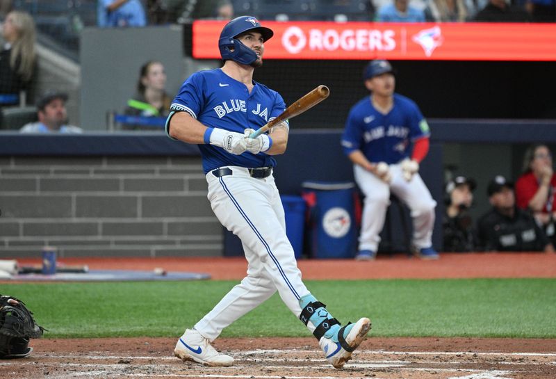 Jul 2, 2024; Toronto, Ontario, CAN;  Toronto Blue Jays second baseman Spencer Horwitz (48) hits a solo home run against the Houston Astros in the third inning at Rogers Centre. Mandatory Credit: Dan Hamilton-USA TODAY Sports