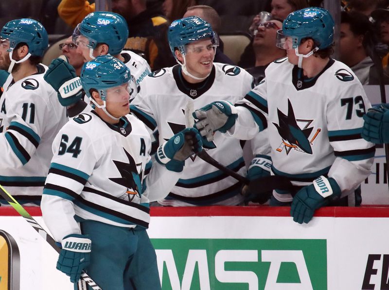 Nov 16, 2024; Pittsburgh, Pennsylvania, USA;  San Jose Sharks center Mikael Granlund (64) celebrates his goal with the Sharks bench against the Pittsburgh Penguins during the third period at PPG Paints Arena. Mandatory Credit: Charles LeClaire-Imagn Images