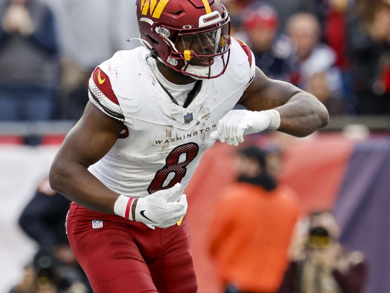 Washington Commanders running back Brian Robinson Jr. (8)prepares to run during the second half an NFL football game against the New England Patriots on Sunday, Nov. 5, 2023, in Foxborough, Mass. (AP Photo/Greg M. Cooper)