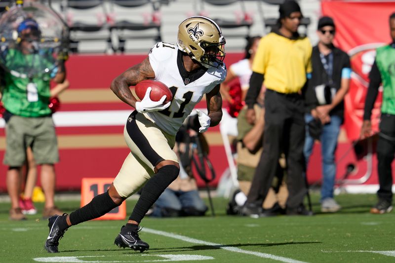 New Orleans Saints' Cedrick Wilson Jr. returns a punt against the San Francisco 49ers during the first half of a preseason NFL football game in Santa Clara, Calif., Sunday, Aug. 18, 2024. (AP Photo/Godofredo A. Vásquez)