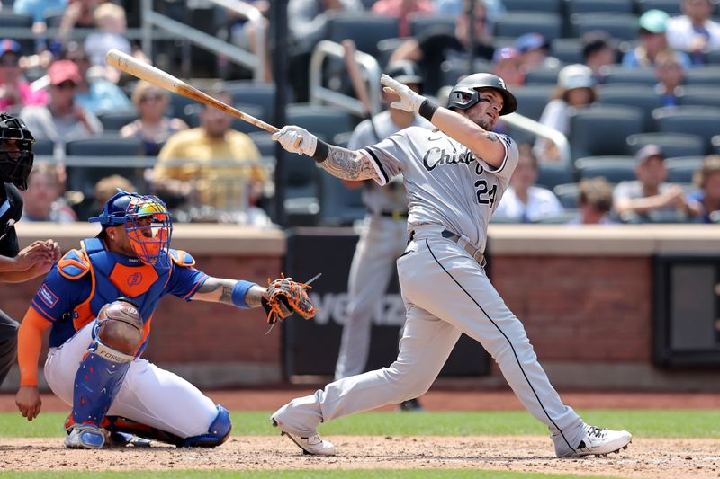 Jul 20, 2023; New York City, New York, USA; Chicago White Sox catcher Yasmani Grandal (24) follows through on a two run double against the New York Mets during the sixth inning at Citi Field. Mandatory Credit: Brad Penner-USA TODAY Sports