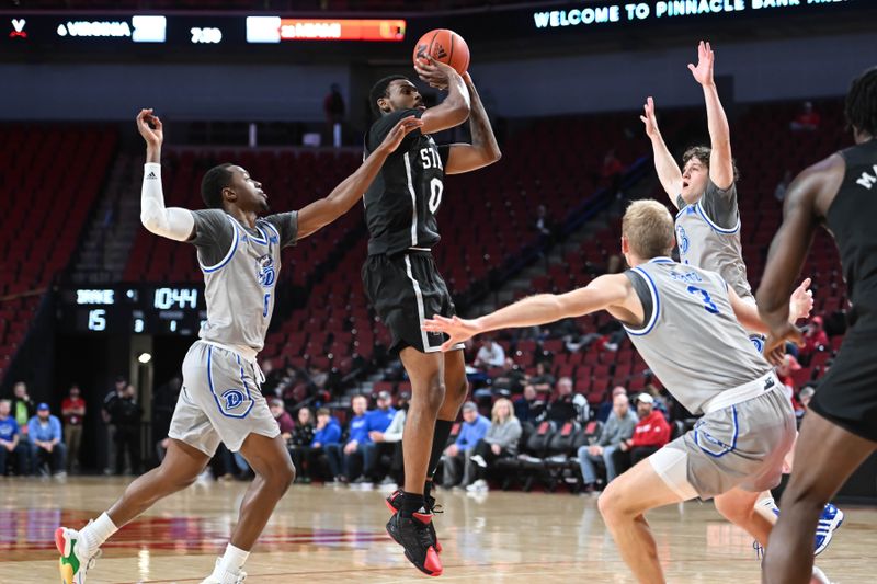 Dec 20, 2022; Lincoln, Nebraska, USA;  Mississippi State Bulldogs forward D.J. Jeffries (0) scores surrounded by three Drake Bulldogs defenders in the first half at Pinnacle Bank Arena. Mandatory Credit: Steven Branscombe-USA TODAY Sports