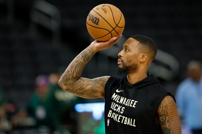 MILWAUKEE, WISCONSIN - OCTOBER 20: Damian Lillard #0 of the Milwaukee Bucks warms up before the preseason game against the Memphis Grizzlies at Fiserv Forum on October 20, 2023 in Milwaukee, Wisconsin. NOTE TO USER: User expressly acknowledges and agrees that, by downloading and or using this photograph, User is consenting to the terms and conditions of the Getty Images License Agreement. (Photo by John Fisher/Getty Images)