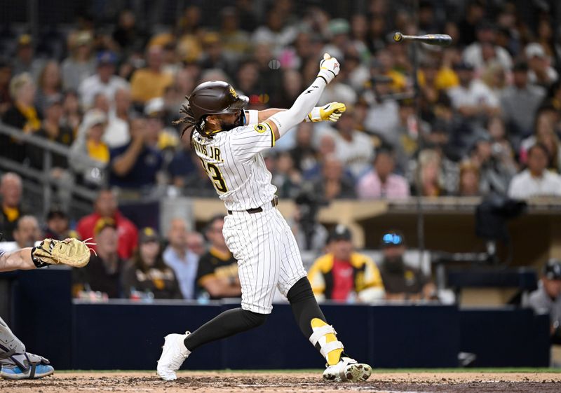 Sep 11, 2025; San Diego, California, USA; San Diego Padres right fielder Fernando Tatis Jr. (23) loses his bat during the seventh inning against the Colorado Rockies at Petco Park. Mandatory Credit: Denis Poroy-Imagn Images