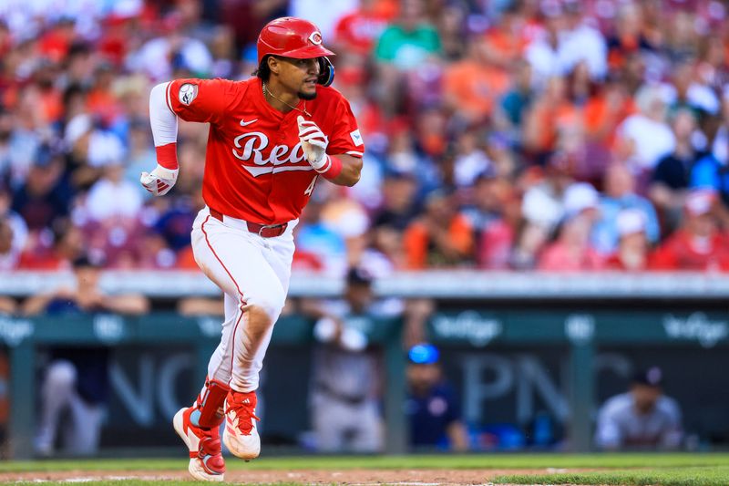 Sep 2, 2024; Cincinnati, Ohio, USA; Cincinnati Reds third baseman Santiago Espinal (4) runs to first after hitting a single in the seventh inning against the Houston Astros at Great American Ball Park. Mandatory Credit: Katie Stratman-USA TODAY Sports