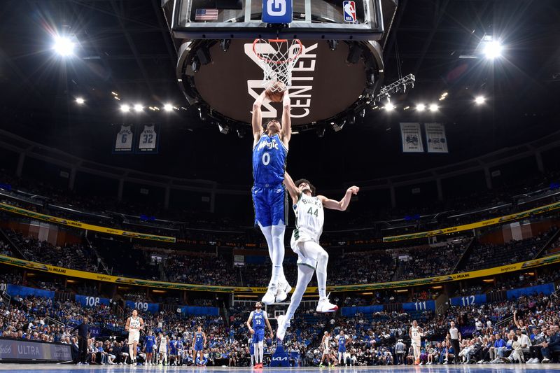 ORLANDO, FL - APRIL 14: Anthony Black #0 of the Orlando Magic drives to the basket during the game against the Milwaukee Bucks on April 14, 2024 at Kia Center in Orlando, Florida. NOTE TO USER: User expressly acknowledges and agrees that, by downloading and or using this photograph, User is consenting to the terms and conditions of the Getty Images License Agreement. Mandatory Copyright Notice: Copyright 2024 NBAE (Photo by Fernando Medina/NBAE via Getty Images)