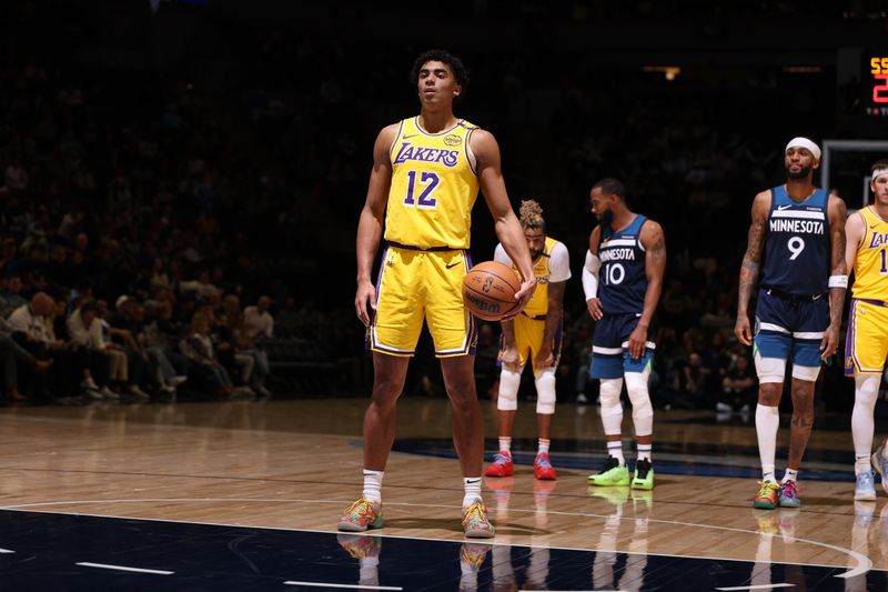 MINNEAPOLIS, MN -  DECEMBER 13:  Max Christie #12 of the Los Angeles Lakers shoots a free throw during the game against the Minnesota Timberwolves on December 13, 2024 at Target Center in Minneapolis, Minnesota. NOTE TO USER: User expressly acknowledges and agrees that, by downloading and or using this Photograph, user is consenting to the terms and conditions of the Getty Images License Agreement. Mandatory Copyright Notice: Copyright 2024 NBAE (Photo by David Sherman/NBAE via Getty Images)