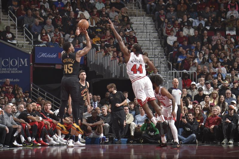 CLEVELAND, OH - November 15: Donovan Mitchell #45 of the Cleveland Cavaliers shoots a three point basket during the game against the Chicago Bulls during the Emirates NBA Cup game on November 15, 2024 at Rocket Mortgage FieldHouse in Cleveland, Ohio. NOTE TO USER: User expressly acknowledges and agrees that, by downloading and/or using this Photograph, user is consenting to the terms and conditions of the Getty Images License Agreement. Mandatory Copyright Notice: Copyright 2024 NBAE (Photo by David Liam Kyle/NBAE via Getty Images)