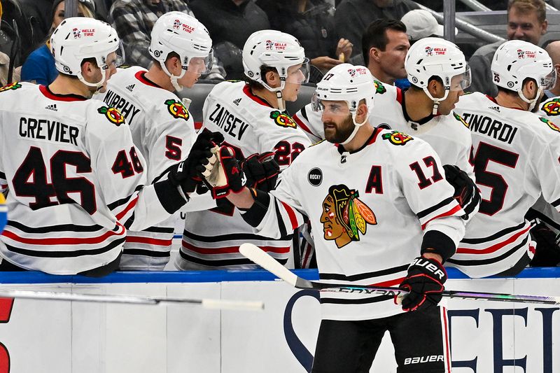 Dec 23, 2023; St. Louis, Missouri, USA;  Chicago Blackhawks left wing Nick Foligno (17) is  congratulated by teammates after scoring against the St. Louis Blues during the second period at Enterprise Center. Mandatory Credit: Jeff Curry-USA TODAY Sports