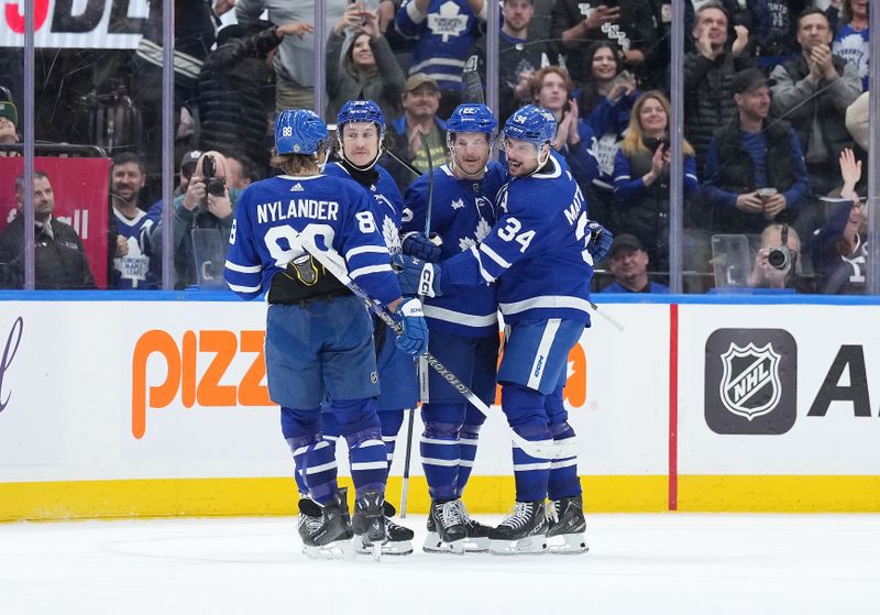 Apr 8, 2024; Toronto, Ontario, CAN; Toronto Maple Leafs defenseman Jake McCabe (22) scores the winning goal and celebrates with teammates against the Pittsburgh Penguins during the overtime period at Scotiabank Arena. Mandatory Credit: Nick Turchiaro-USA TODAY Sports