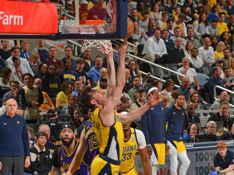 INDIANAPOLIS, IN - MARCH 29: T.J. McConnell #9 of the Indiana Pacers drives to the basket during the game against the Los Angeles Lakers on March 24, 2024 at Gainbridge Fieldhouse in Indianapolis, Indiana. NOTE TO USER: User expressly acknowledges and agrees that, by downloading and or using this Photograph, user is consenting to the terms and conditions of the Getty Images License Agreement. Mandatory Copyright Notice: Copyright 2024 NBAE (Photo by Jesse D. Garrabrant /NBAE via Getty Images)