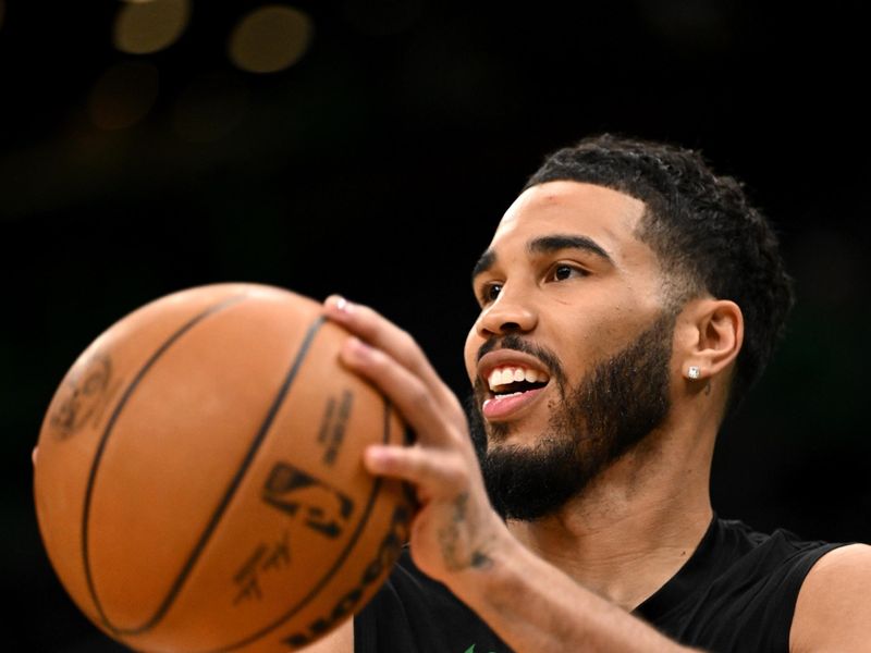 BOSTON, MASSACHUSETTS - MARCH 01: Jayson Tatum #0 of the Boston Celtics takes a shot before a game against the Dallas Mavericks at the TD Garden on March 01, 2024 in Boston, Massachusetts. NOTE TO USER: User expressly acknowledges and agrees that, by downloading and or using this photograph, User is consenting to the terms and conditions of the Getty Images License Agreement. (Photo by Brian Fluharty/Getty Images)