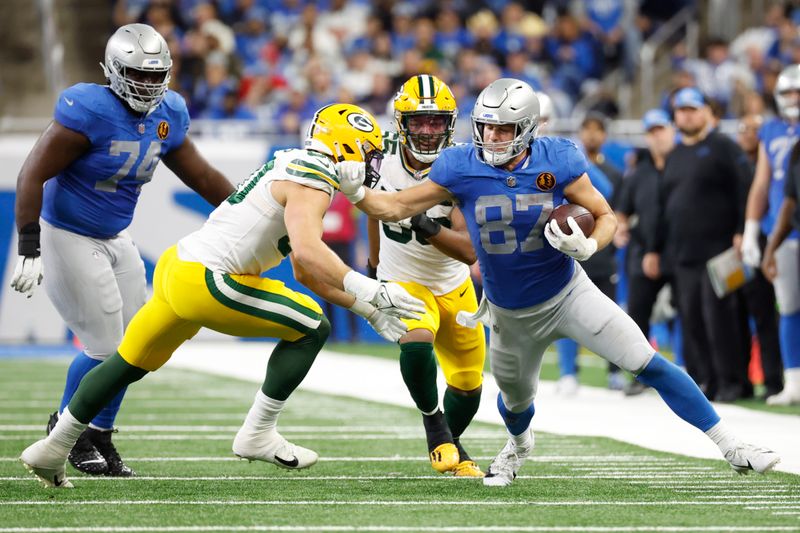 Detroit Lions tight end Sam LaPorta (87) runs the ball against the Green Bay Packers in the second half of an NFL football game at Ford Field in Detroit, Thursday, Nov. 23, 2023. (AP Photo/Rick Osentoski)