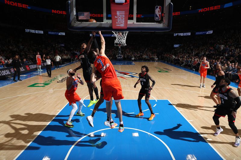 OKLAHOMA CITY, OK - MARCH 27:  Amen Thompson #1 of the Houston Rockets grabs a rebound during the game against the Oklahoma City Thunder on March 27, 2024 at Paycom Arena in Oklahoma City, Oklahoma. NOTE TO USER: User expressly acknowledges and agrees that, by downloading and or using this photograph, User is consenting to the terms and conditions of the Getty Images License Agreement. Mandatory Copyright Notice: Copyright 2024 NBAE (Photo by Zach Beeker/NBAE via Getty Images)