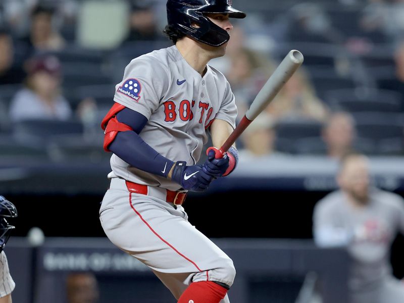 Jun 7, 2025; Bronx, New York, USA; Boston Red Sox third baseman Marcelo Mayer (39) follows through on a single against the New York Yankees during the ninth inning at Yankee Stadium. Mandatory Credit: Brad Penner-Imagn Images