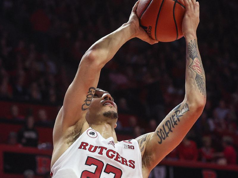 Jan 5, 2023; Piscataway, New Jersey, USA; Rutgers Scarlet Knights guard Caleb McConnell (22) drives to the basket against the Maryland Terrapins during the second half at Jersey Mike's Arena. Mandatory Credit: Vincent Carchietta-USA TODAY Sports