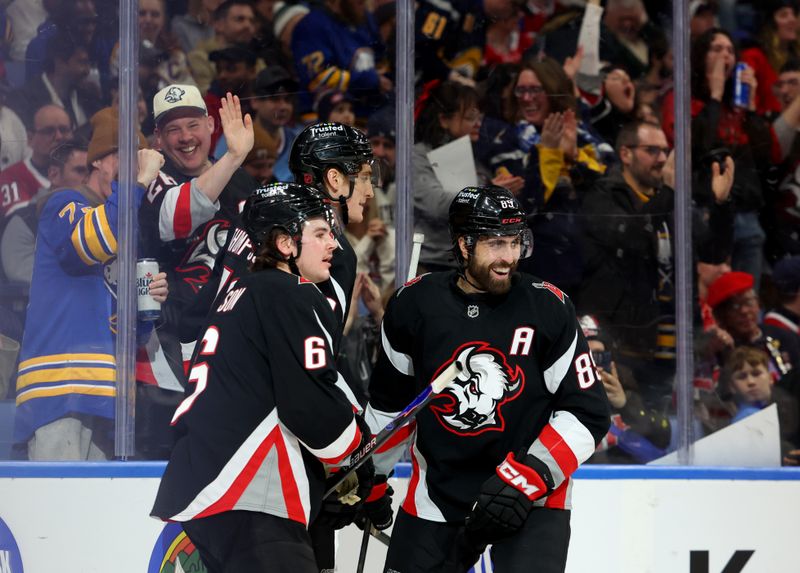 Jan 15, 2026; Buffalo, New York, USA;  Buffalo Sabres right wing Alex Tuch (89) celebrates his goal with teammates during the second period against the Montréal Canadiens at KeyBank Center. Mandatory Credit: Timothy T. Ludwig-Imagn Images
