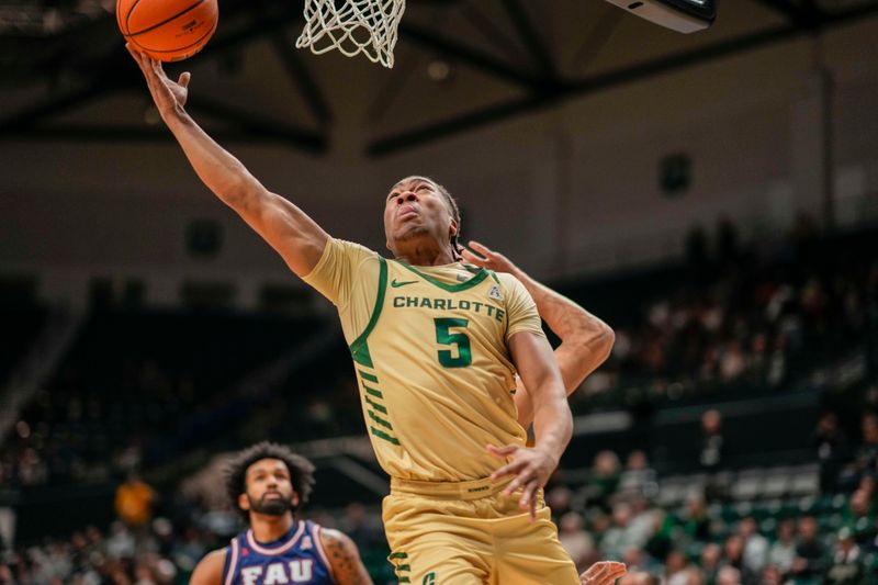 Jan 6, 2024; Charlotte, North Carolina, USA; Charlotte 49ers guard Isaiah Folkes (5) goes up for a layup against the Florida Atlantic Owls during the first half at Dale F. Halton Arena. Mandatory Credit: Jim Dedmon-USA TODAY Sports