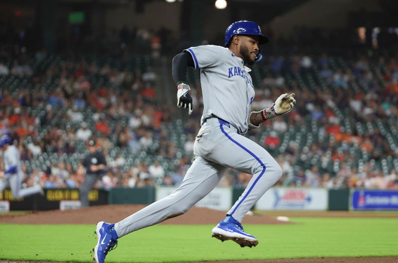 May 14, 2025; Houston, Texas, USA; Kansas City Royals third baseman Maikel Garcia (11) hits a RBI double against the Houston Astros  in the fifth inning at Daikin Park. Mandatory Credit: Thomas Shea-Imagn Images