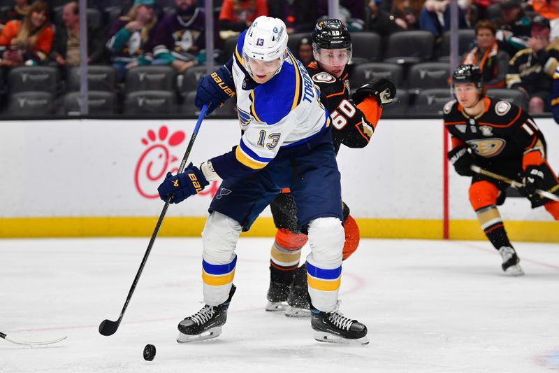 Apr 7, 2024; Anaheim, California, USA; St. Louis Blues right wing Alexey Toropchenko (13) moves in for a shot against the Anaheim Ducks during the first period at Honda Center. Mandatory Credit: Gary A. Vasquez-USA TODAY Sports