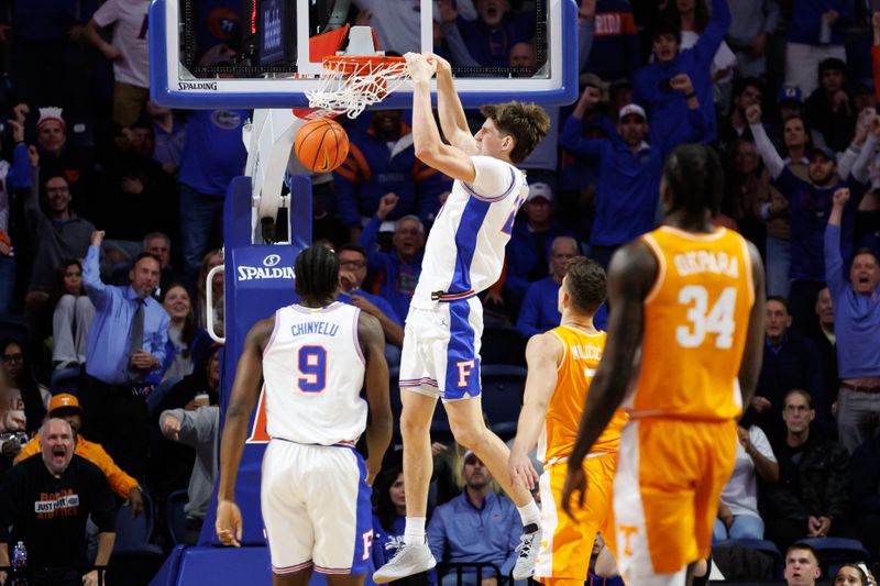 Jan 7, 2025; Gainesville, Florida, USA; Florida Gators forward Alex Condon (21) dunks the ball against the Tennessee Volunteers during the first half at Exactech Arena at the Stephen C. O'Connell Center. Mandatory Credit: Matt Pendleton-Imagn Images