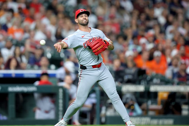 May 9, 2025; Houston, Texas, USA; HCincinnati Reds pitcher Nick Martinez (28) throws a fielded ball to first base for an out against the Houston Astros during the fourth inning at Daikin Park. Mandatory Credit: Erik Williams-Imagn Images