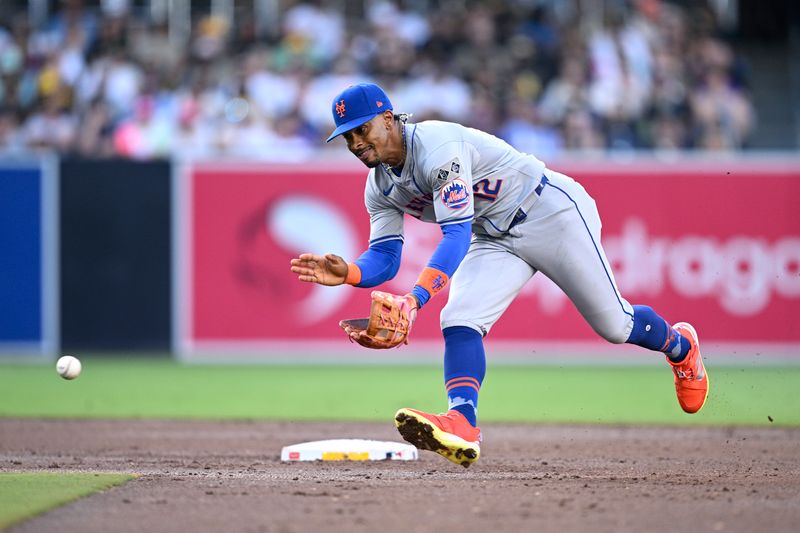 Aug 24, 2024; San Diego, California, USA; New York Mets shortstop Francisco Lindor (12) fields a ground ball hit by San Diego Padres first baseman Luis Arraez (not pictured) during the third inning at Petco Park. Mandatory Credit: Orlando Ramirez-USA TODAY Sports