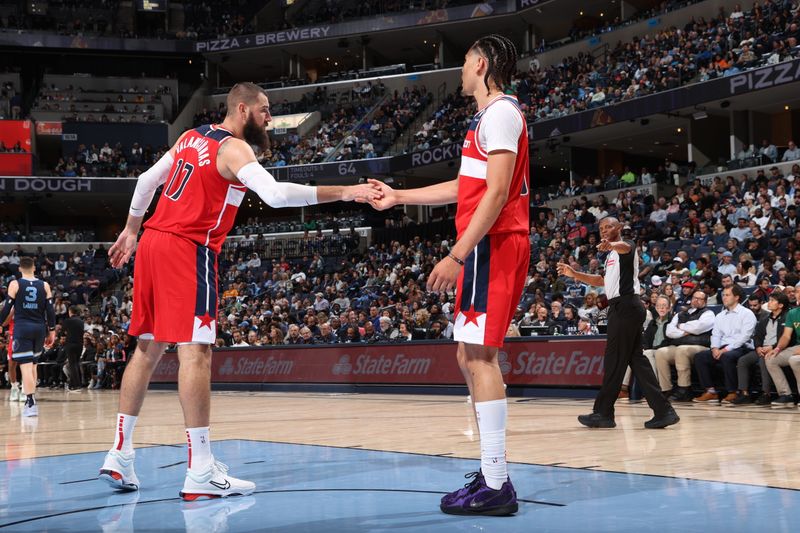 MEMPHIS, TN - NOVEMBER 8: Jonas Valanciunas #17 and Kyshawn George #18 of the Washington Wizards high five during the game against the Memphis Grizzlies on November 8, 2024 at FedExForum in Memphis, Tennessee. NOTE TO USER: User expressly acknowledges and agrees that, by downloading and or using this photograph, User is consenting to the terms and conditions of the Getty Images License Agreement. Mandatory Copyright Notice: Copyright 2024 NBAE (Photo by Joe Murphy/NBAE via Getty Images)