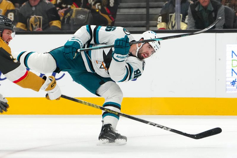 Oct 26, 2024; Las Vegas, Nevada, USA; San Jose Sharks defenseman Jake Walman (96) shoots against the Vegas Golden Knights during the first period at T-Mobile Arena. Mandatory Credit: Stephen R. Sylvanie-Imagn Images