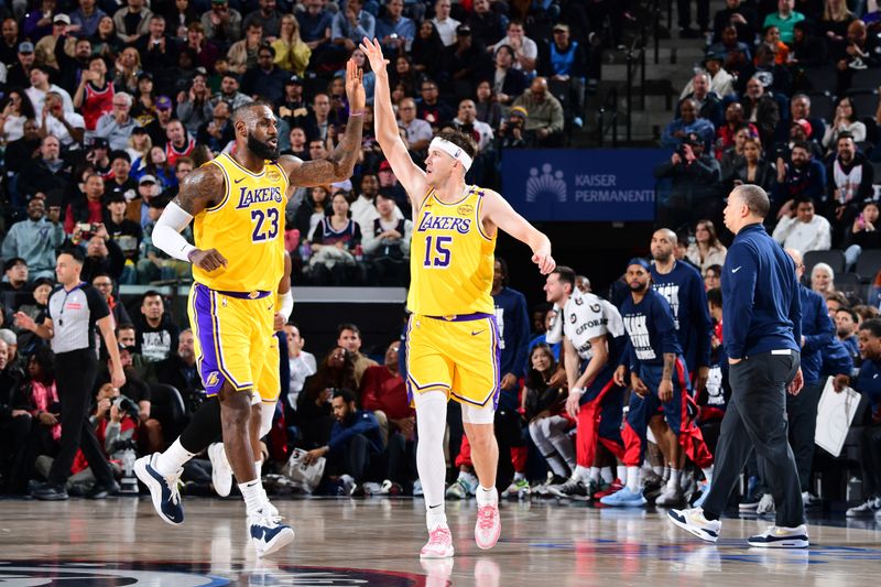 INGLEWOOD, CA - FEBRUARY 4: LeBron James #23 high fives Austin Reaves #15 of the Los Angeles Lakers during the game against the LA Clippers on February 4, 2025 at Intuit Dome in Los Angeles, California. NOTE TO USER: User expressly acknowledges and agrees that, by downloading and/or using this Photograph, user is consenting to the terms and conditions of the Getty Images License Agreement. Mandatory Copyright Notice: Copyright 2025 NBAE (Photo by Adam Pantozzi/NBAE via Getty Images)