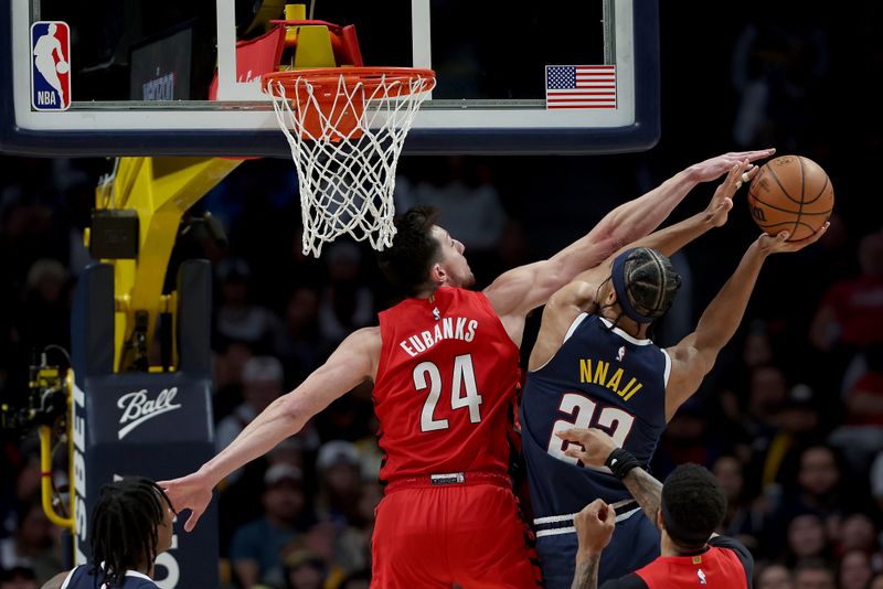 DENVER, COLORADO - JANUARY 17:  Zeke Nnaji #22 the Denver Nuggets goes to the basket against Drew Eubanks #24 of the Portland Trail Blazers in the second quarter at Ball Arena on January 17, 2023 in Denver, Colorado. NOTE TO USER: User expressly acknowledges and agrees that, by downloading and/or using this photograph, User is consenting to the terms and conditions of the Getty Images License Agreement. (Photo by Matthew Stockman/Getty Images)