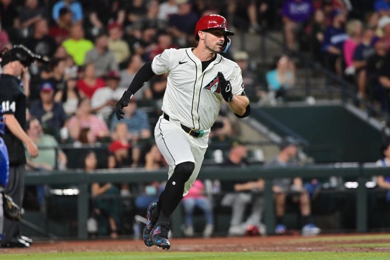 Apr 17, 2024; Phoenix, Arizona, USA;  Arizona Diamondbacks outfielder Randal Grichuk (15) doubles in the sixth inning against the Chicago Cubs at Chase Field. Mandatory Credit: Matt Kartozian-USA TODAY Sports