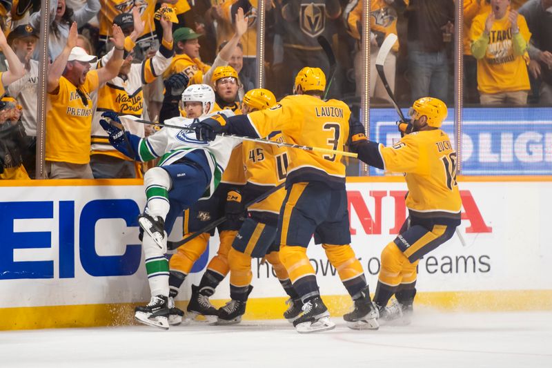 Apr 28, 2024; Nashville, Tennessee, USA; Vancouver Canucks center Elias Pettersson (40) gets hit as Nashville Predators center Mark Jankowski (17) celebrates his goal during the first period in game four of the first round of the 2024 Stanley Cup Playoffs at Bridgestone Arena. Mandatory Credit: Steve Roberts-USA TODAY Sports