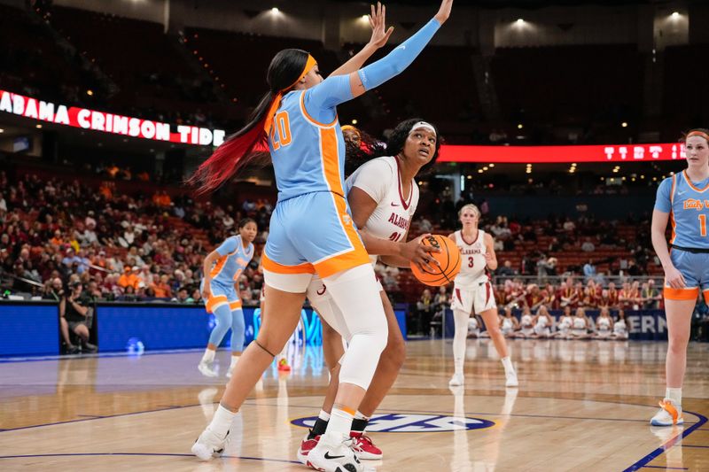 Mar 8, 2024; Greensville, SC, USA; Alabama Crimson Tide forward Essence Cody (21) tries to shoot around Tennessee Lady Vols center Tamari Key (20) during the first half at Bon Secours Wellness Arena. Mandatory Credit: Jim Dedmon-USA TODAY Sports