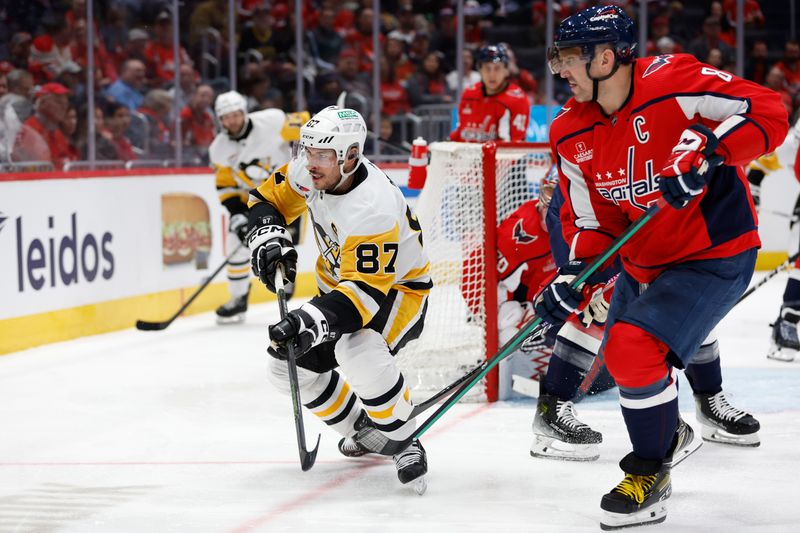 Apr 4, 2024; Washington, District of Columbia, USA; Pittsburgh Penguins center Sidney Crosby (87) and Washington Capitals left wing Alex Ovechkin (8) chase the puck in the second period at Capital One Arena. Mandatory Credit: Geoff Burke-USA TODAY Sports