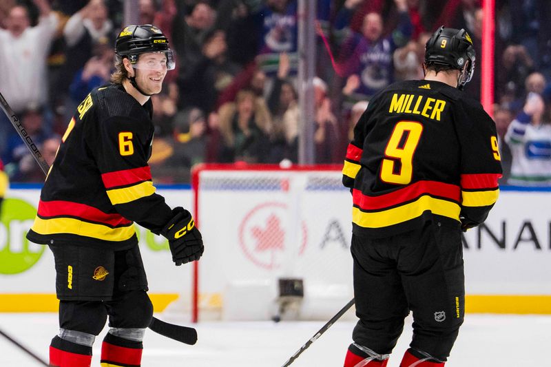 Dec 12, 2023; Vancouver, British Columbia, CAN; Vancouver Canucks forward Brock Boeser (6) and forward J.T. Miller (9) celebrate Boeser   s third goal of the game against the Tampa Bay Lightning in the third period at Rogers Arena. Vancouver won 4-1. Mandatory Credit: Bob Frid-USA TODAY Sports