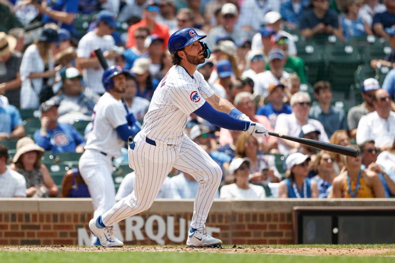 Jun 19, 2024; Chicago, Illinois, USA; Chicago Cubs shortstop Dansby Swanson (7) hits a solo home run against the Chicago Cubs during the fourth inning at Wrigley Field. Mandatory Credit: Kamil Krzaczynski-USA TODAY Sports