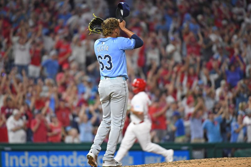 Sep 10, 2024; Philadelphia, Pennsylvania, USA; Tampa Bay Rays pitcher Edwin Uceta (63) reacts after allowing a home run during the eighth inning against the Philadelphia Phillies at Citizens Bank Park. Mandatory Credit: Eric Hartline-Imagn Images