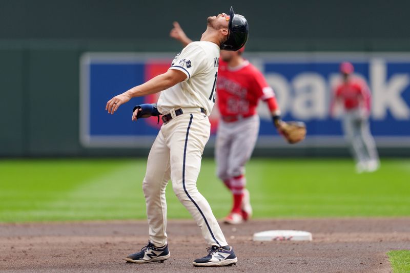 Sep 24, 2023; Minneapolis, Minnesota, USA; Minnesota Twins first baseman Alex Kirilloff (19) watches a fly ball to center field hit by shortstop Kyle Farmer (12) in the second inning against the Los Angeles Angels at Target Field. Mandatory Credit: Matt Blewett-USA TODAY Sports